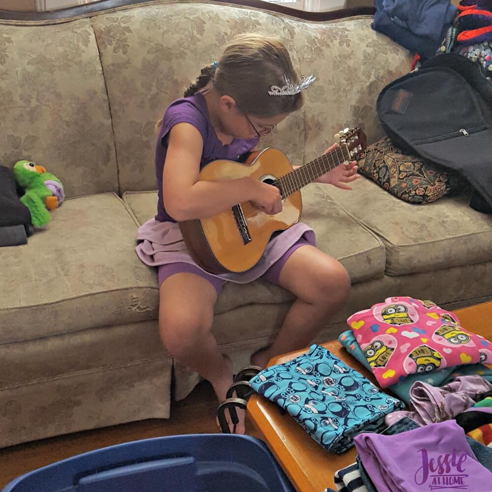 Kyla playing her new guitar