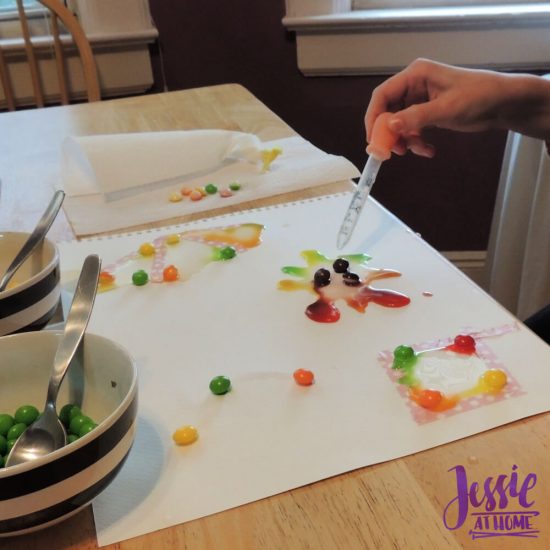 Painting with Skittles craft tutorial by Jessie At Home - Vada dropping